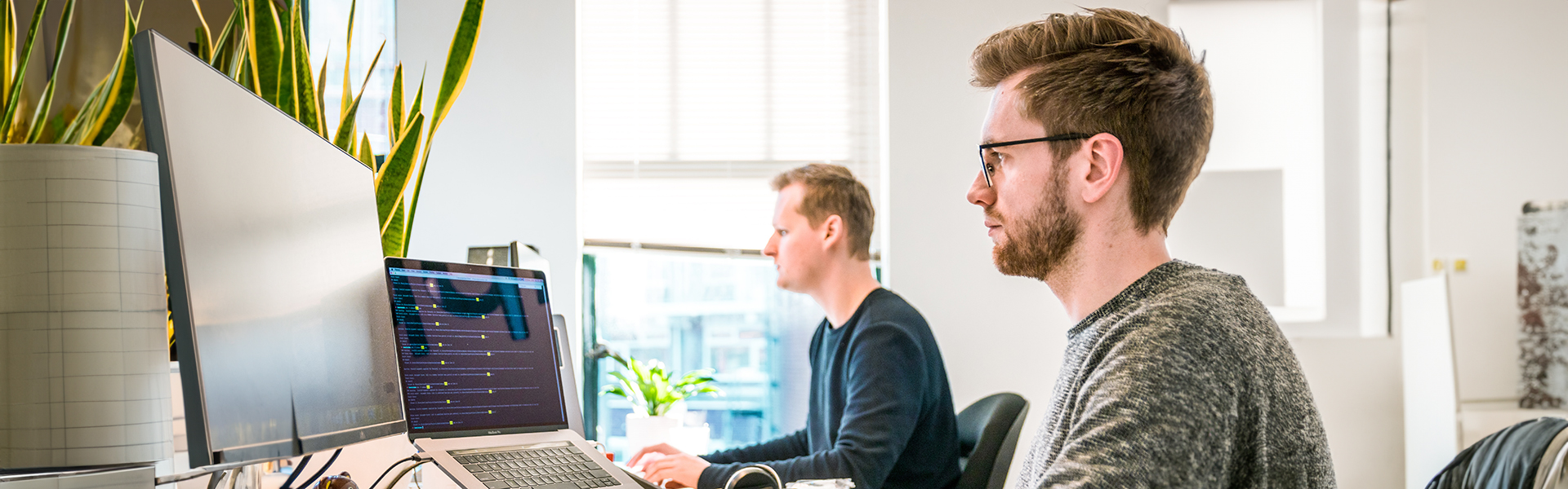 Two people working on computer